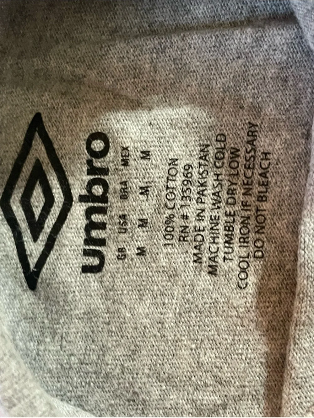 Umbro Kids Black Athletic Shorts with Gray T-Shirt and socks